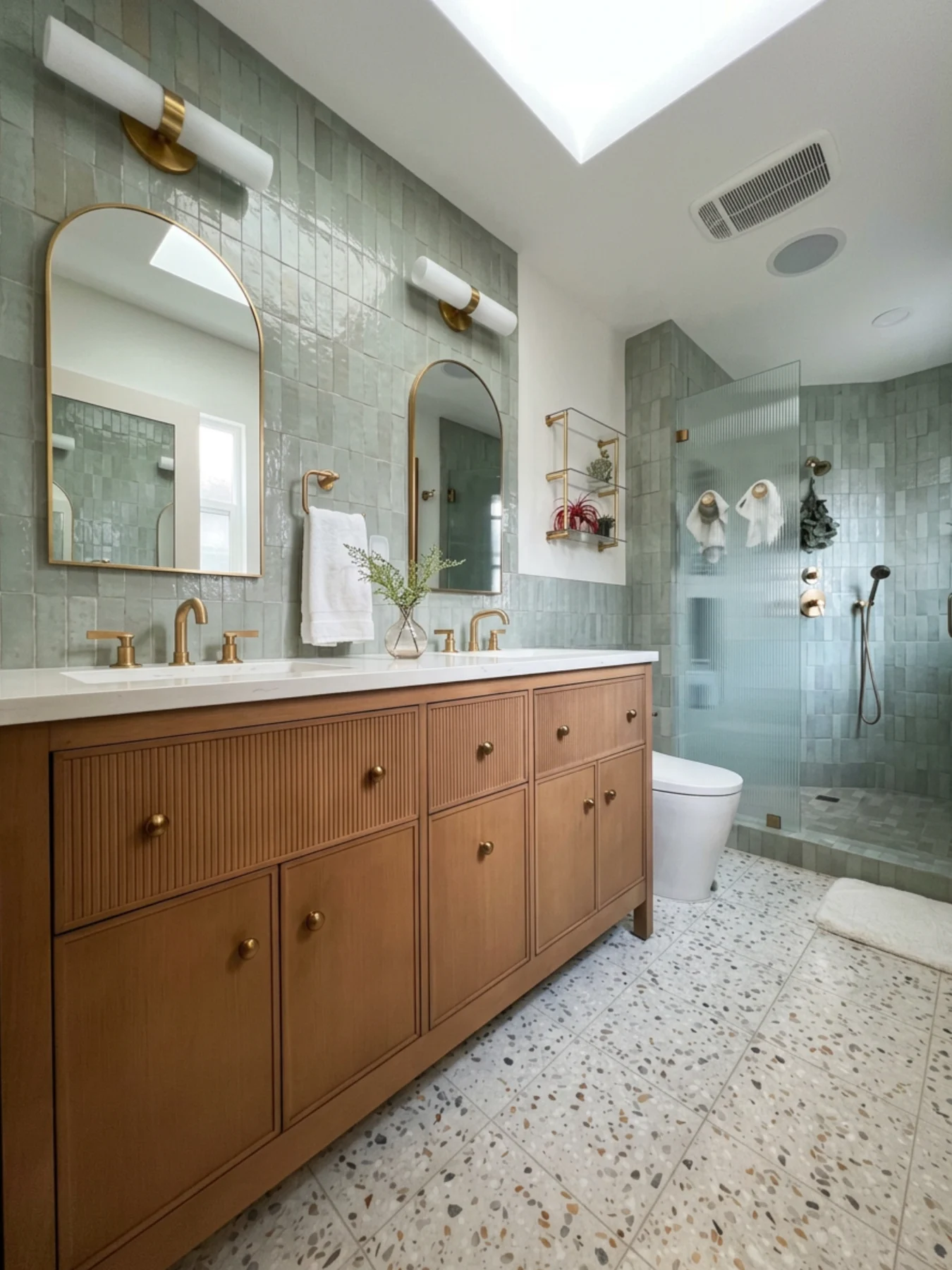 Sage-green zellige tile bathroom with terrazzo floor