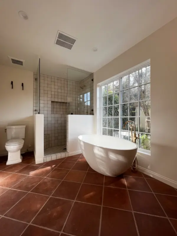 Remodeled bathroom with custom tile and premium fixtures