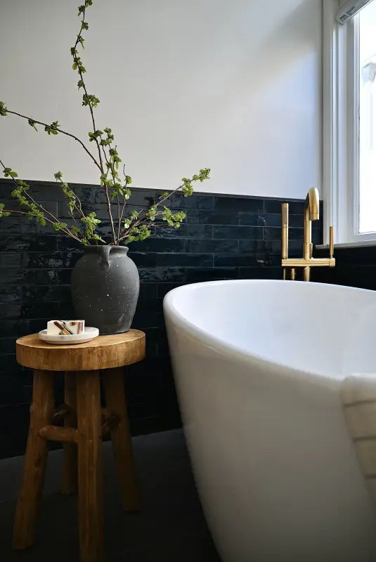 Walk-in shower with layered blue tile