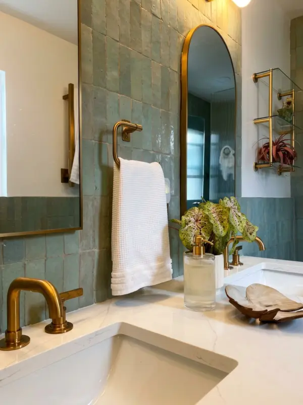 Sage zellige tile shower with fluted glass and brass
