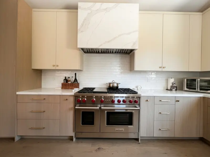 Desert oak kitchen with painted lower cabinetry