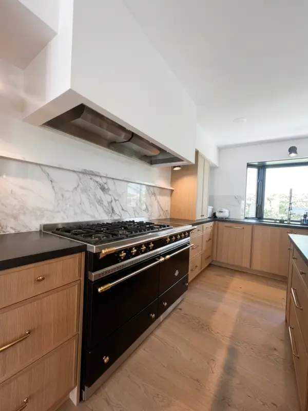 White oak kitchen with tall pantry cabinetry
