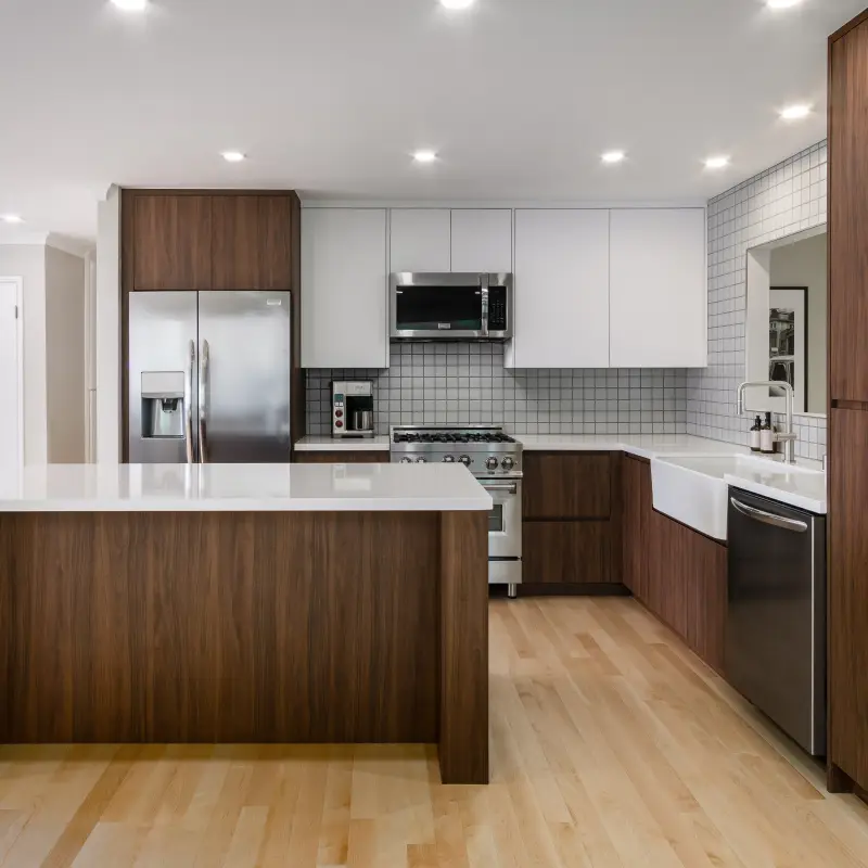 Two-tone walnut and white flat-panel kitchen